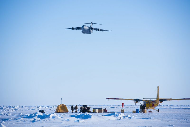 An airplane passes by a region in the North Pole