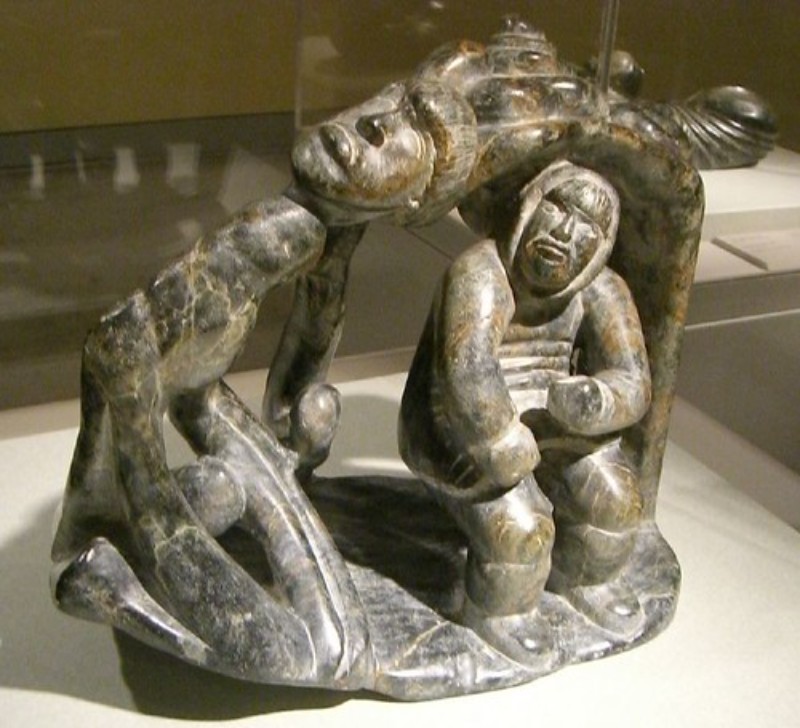 An Inuit sculpture portrays a person's head getting cut off due to the Aurora