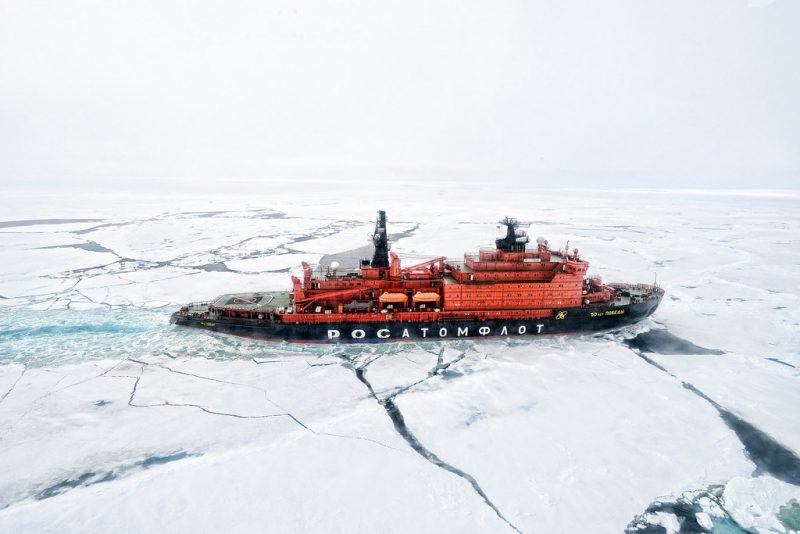 An icebreaker cuts through the ice sheets in the North Pole