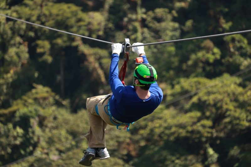 Zip lining through a forest