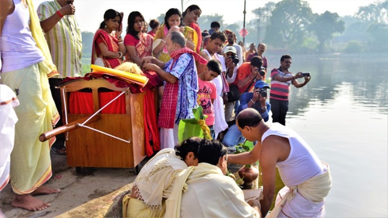 A procession follows the Kola Bou ritual