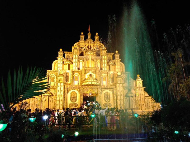 A Durga Puja pandal lit up brightly