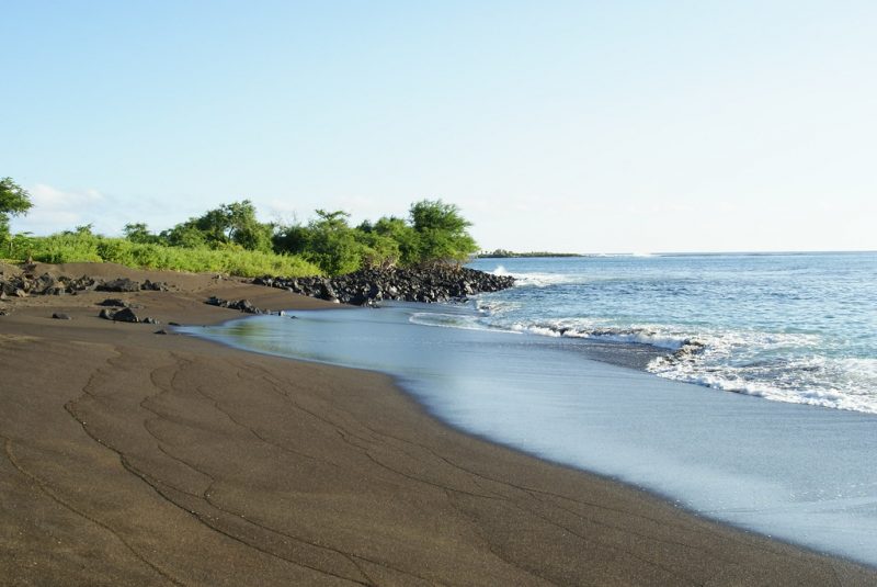 The unusual Black Beach in Floreana Island