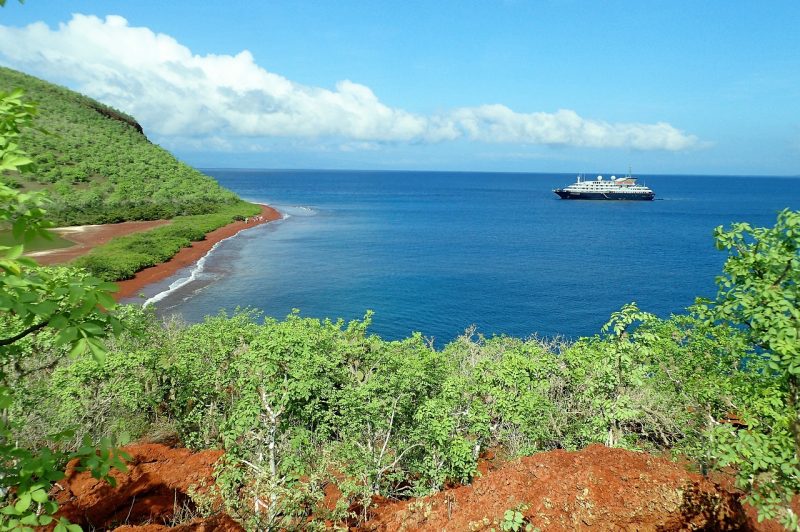 A cruise sails in the Rabida Island of Galapagos