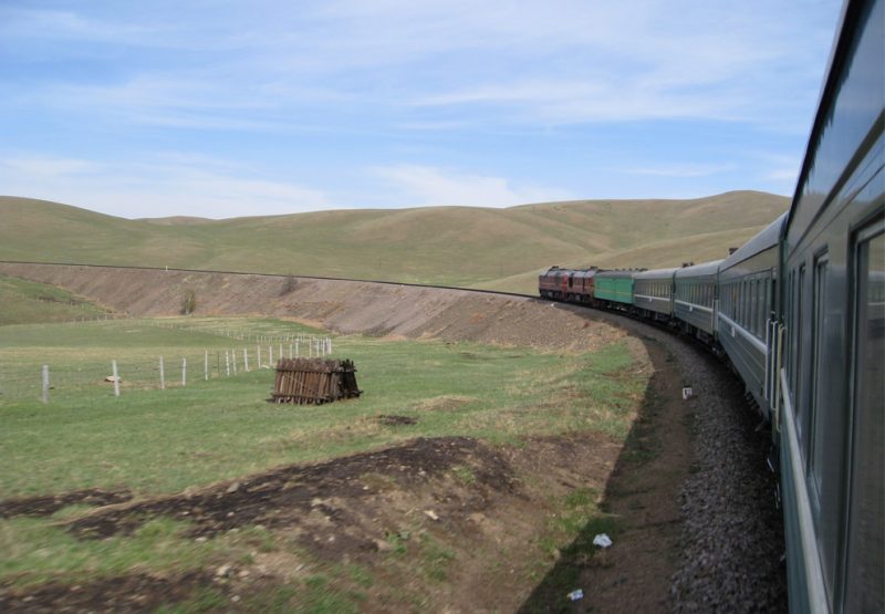 A train passes through beautiful Mongolian landscapes